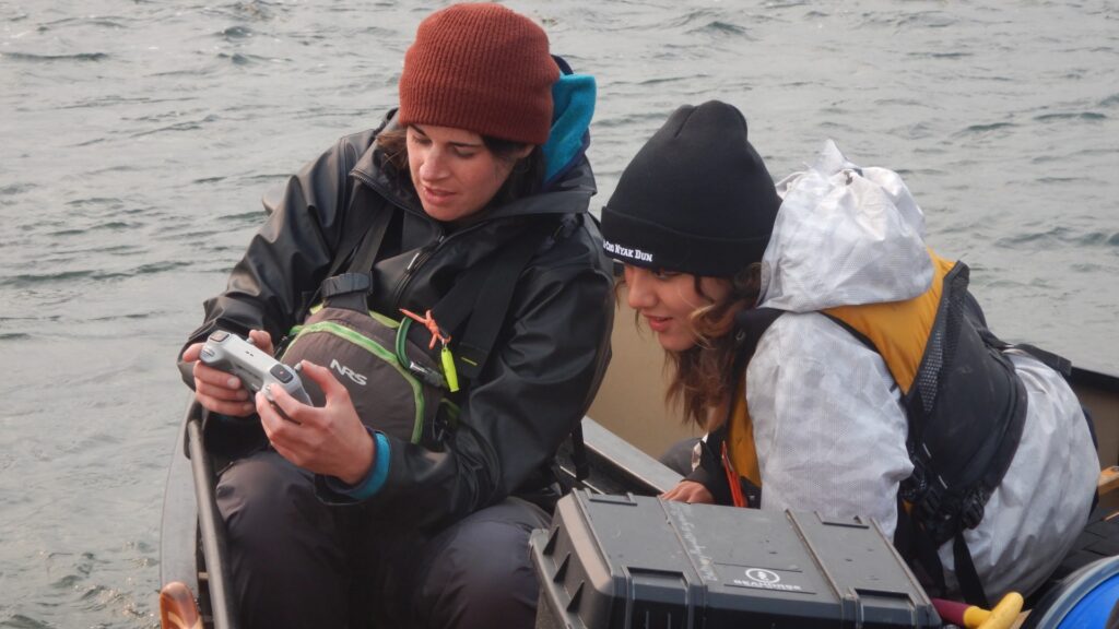 outdoor-videography-in-boat-with-two-people-using-camera