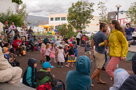 bouncing-pika-kids-dancing-in-a-busy-community-gathering